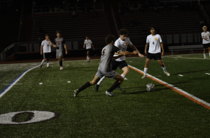 Calen Aherne plays against River Dell in a boys' soccer game.